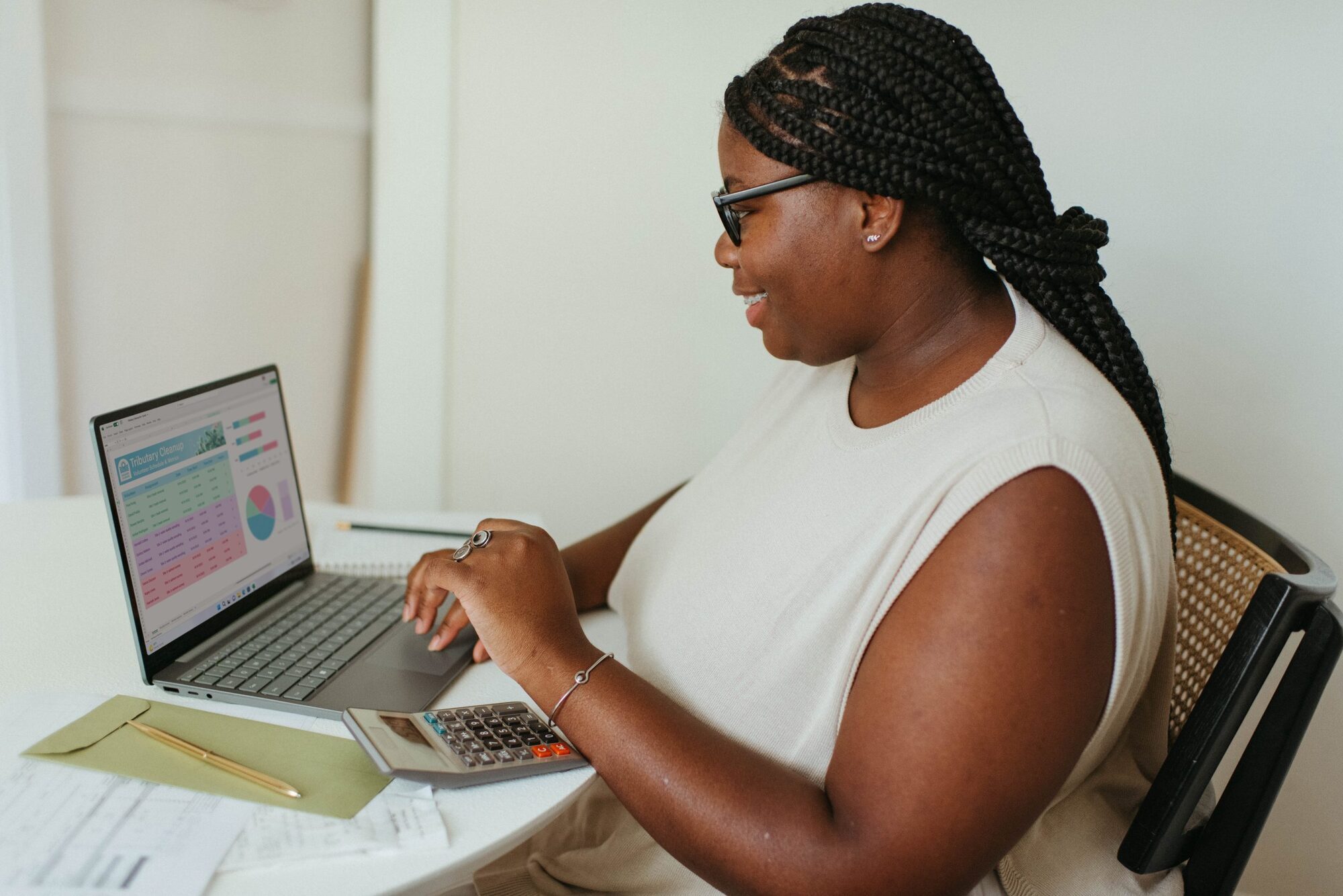 A woman working on reports on a laptop