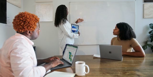 A team working on laptops