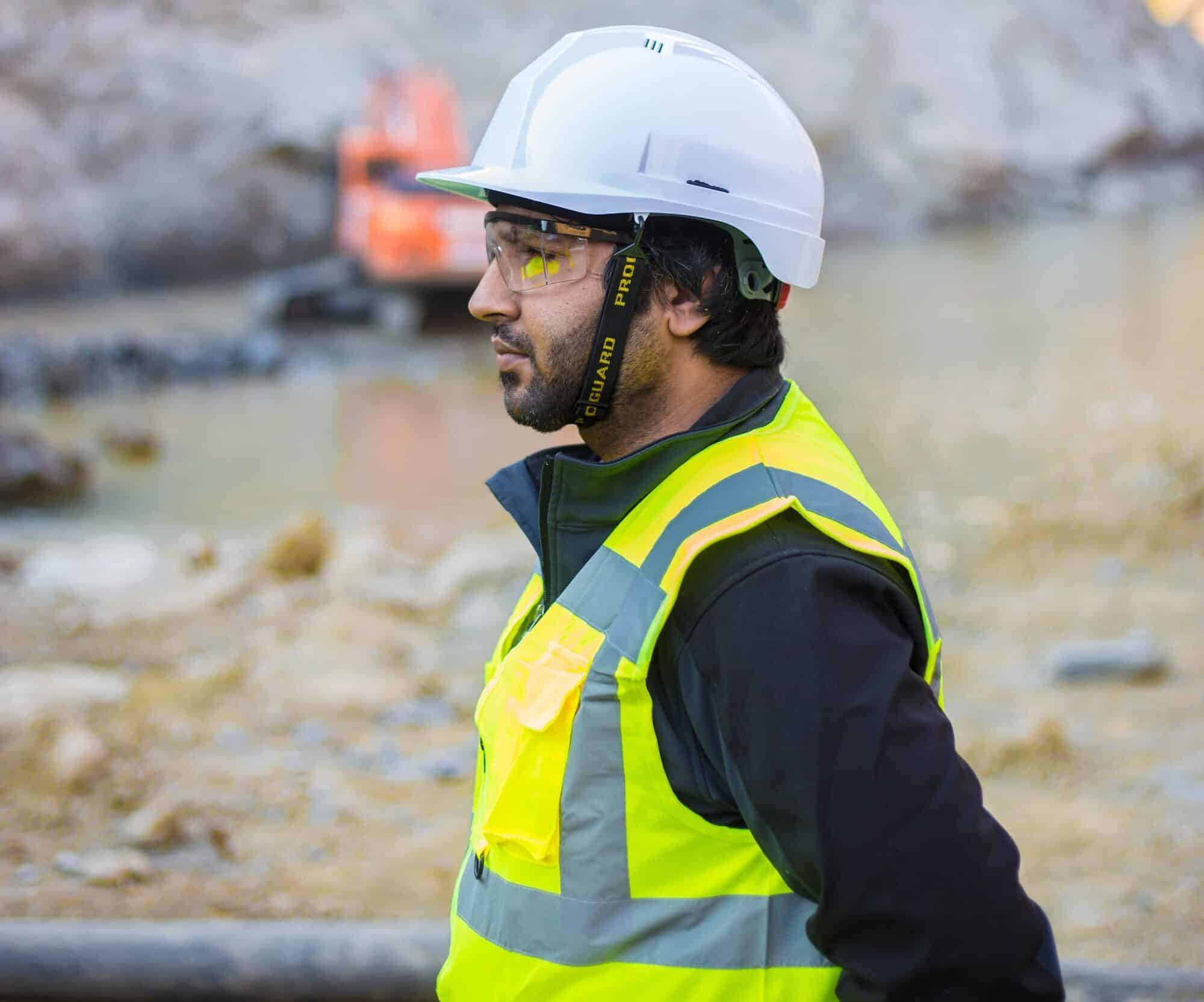 Health and safety engineering in a hard hat and high visibility jacket