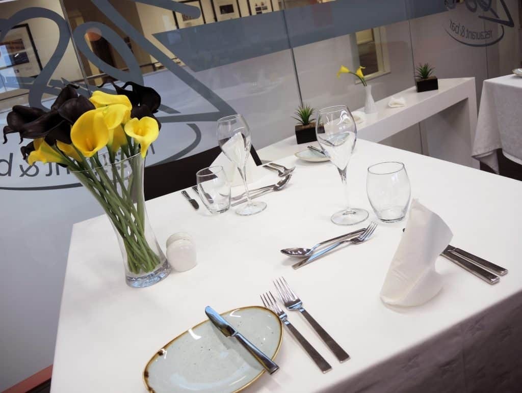 Set tables at the Zest restaurant at Dumfries Campus
